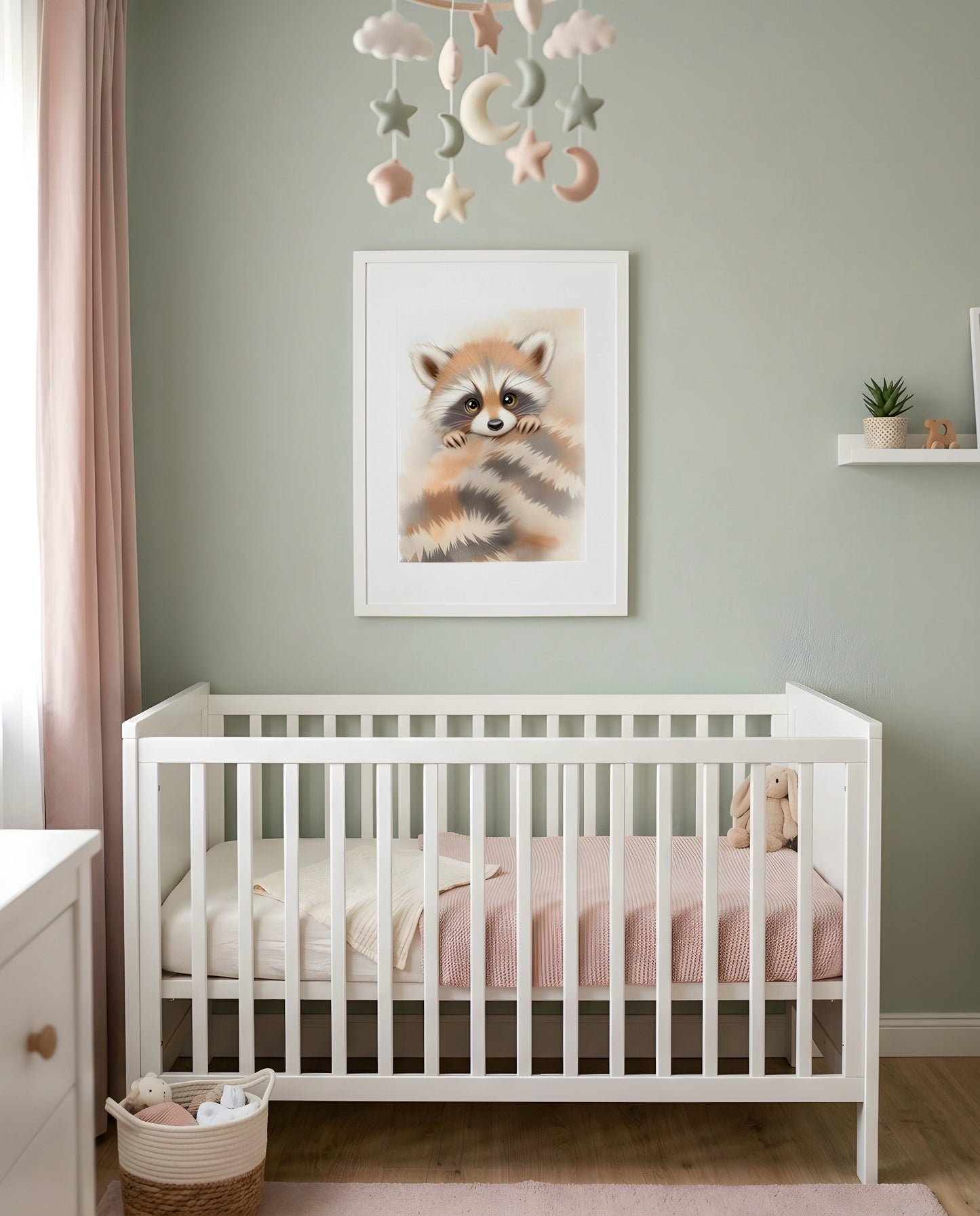 Nursery Minimal Raccoon Watercolor Printable Wall Art — framed above a crib in a softly lit nursery