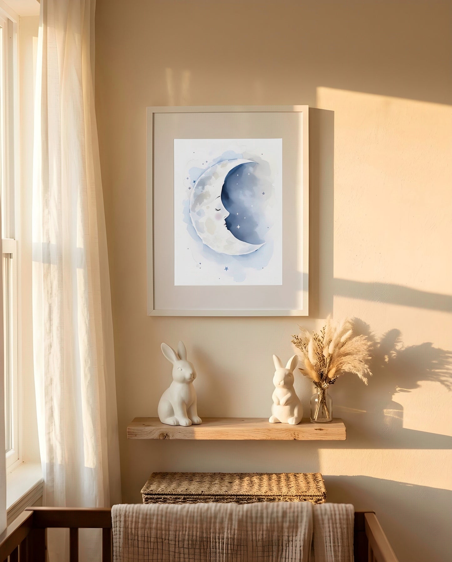 Nursery Sleeping Moon Minimal Watercolor Printable Wall Art — framed in white on a neutral wall