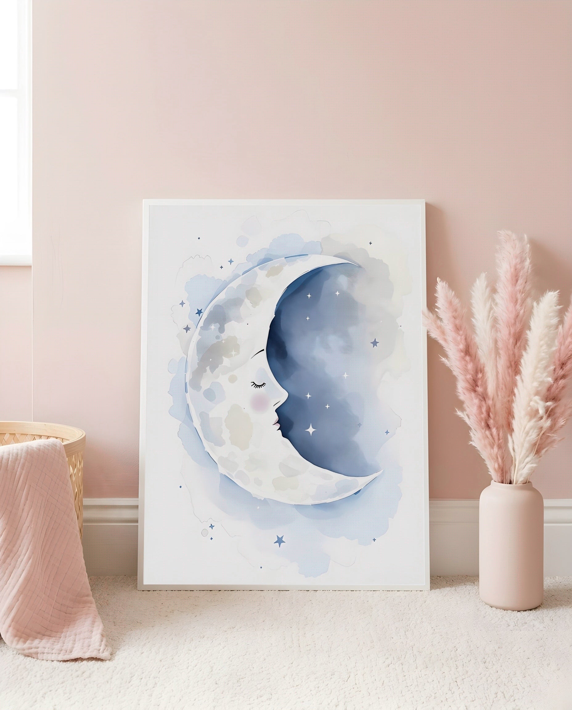 Nursery Sleeping Moon Minimal Watercolor Printable Wall Art — leaning against a light wall in a styled setting