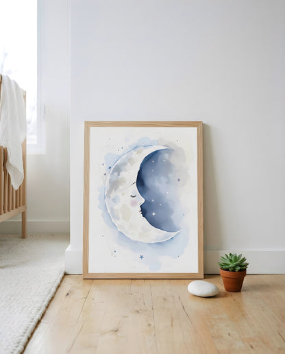 Nursery Sleeping Moon Minimal Watercolor Printable Wall Art — leaning against a wall in a styled setting